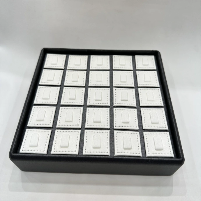 Premium MDF ring tray covered in black rexine with white rexine ring holders, offering an elegant and professional jewellery display.