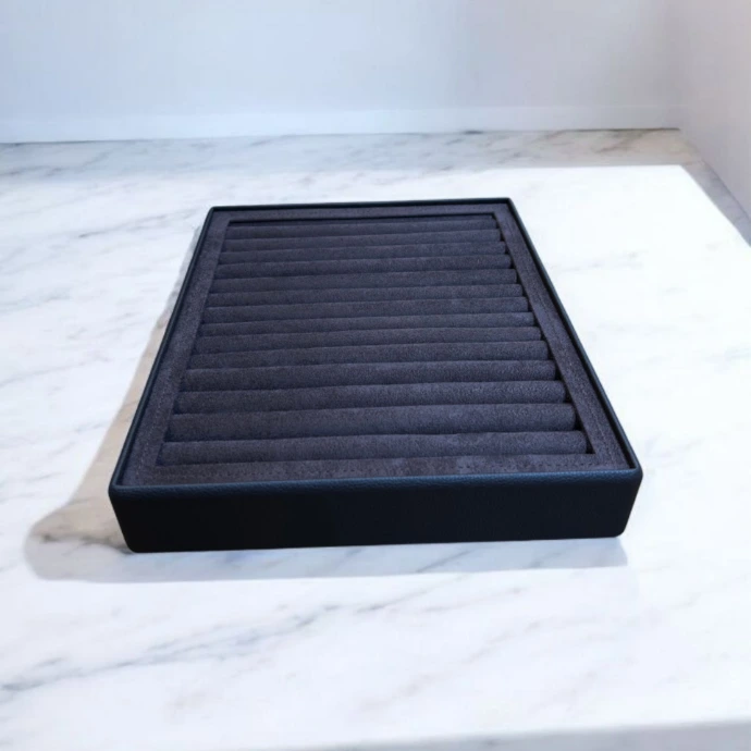 Elegant ring tray featuring a brown rexine exterior with soft brown suede ring holders, designed for a neat ring display.