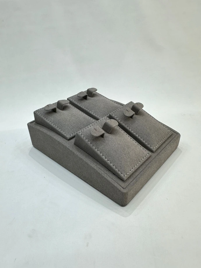 Stylish earring tray crafted from MDF and finished with gray microfiber material, offering an elegant and organized display for earrings.