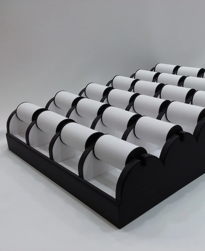Elegant bangle tray featuring a black rexine finish with a white rexine bangle holder, creating a stylish and eye-catching display.