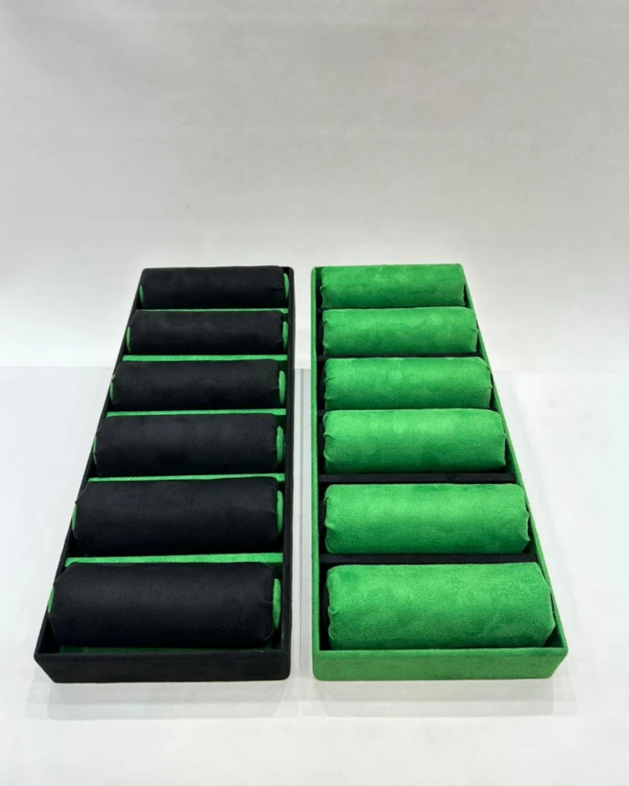 Stylish bangle tray covered in black and green suede, designed to showcase bangles with elegance and a modern touch.