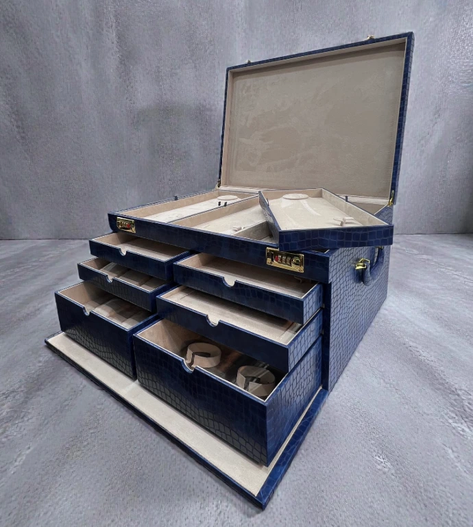 Luxury jewellery storage box with a premium croco rexine exterior and soft suede interior. Designed with multiple trays and compartments for organized jewellery storage and elegant display.