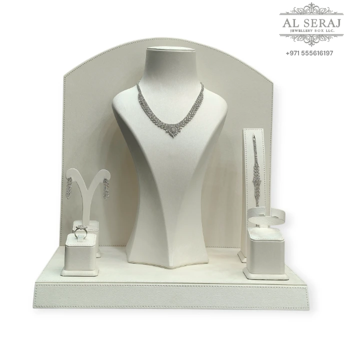 Elegant jewellery display set crafted with premium white rexine, featuring dedicated holders for rings, earrings, bangles, bracelets, and necklaces with a matching base. Perfect for stylish jewellery showcasing and organized display.